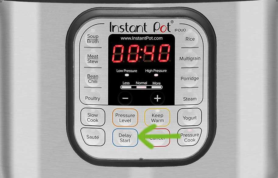 Instant pot control panel with the delay button mark in green