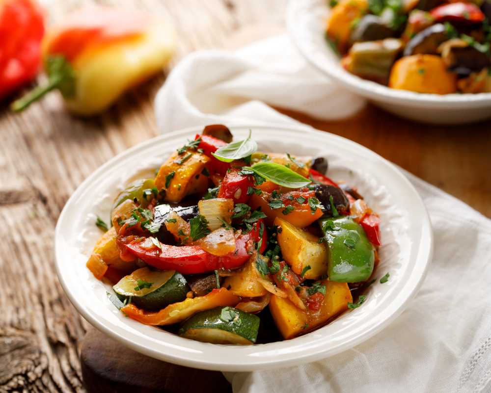 Roasted zucchini, bell pepper, onion and eggplant in white bowl
