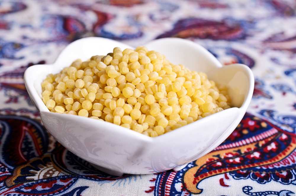 White bowl of Israeli Couscous ready for cooking
