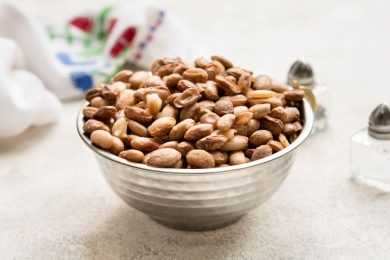 Roasted pinto beans in a metal bowl
