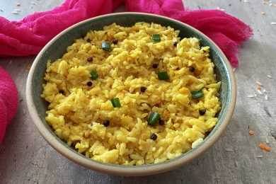 Yellow rice with cooked lentils and chopped scallion on top