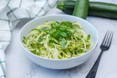 Zucchini Noodles with basil and parmesan cheese on top