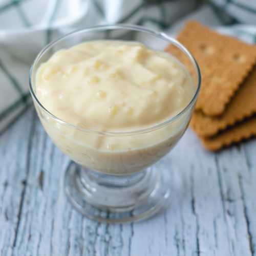 Tapioca Pudding in a glass with square cookie on side