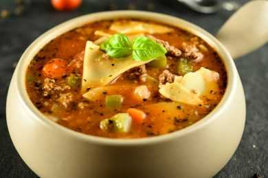 Lasagna soup with ground beef, lasagna noodles, crushed tomatoes, bell peppers, basil and spices