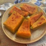 Kabocha Squash pieces with spoons with paprika, salt and turmeric