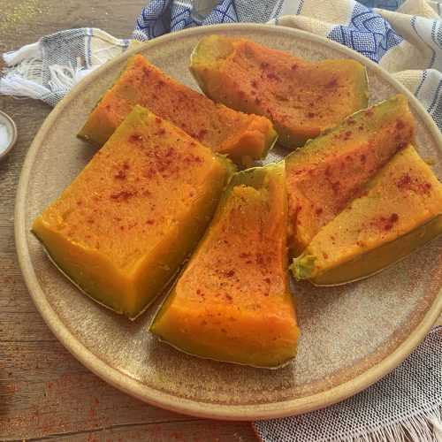 Kabocha Squash pieces with spoons with paprika, salt and turmeric