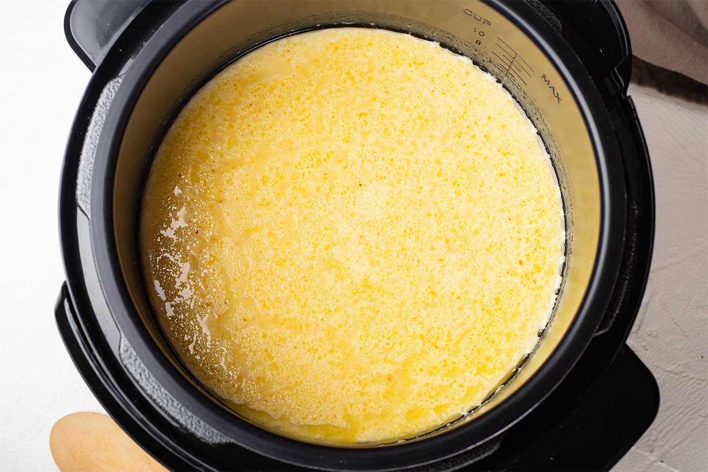 adding the grits and water and milk to the Instant Pot 