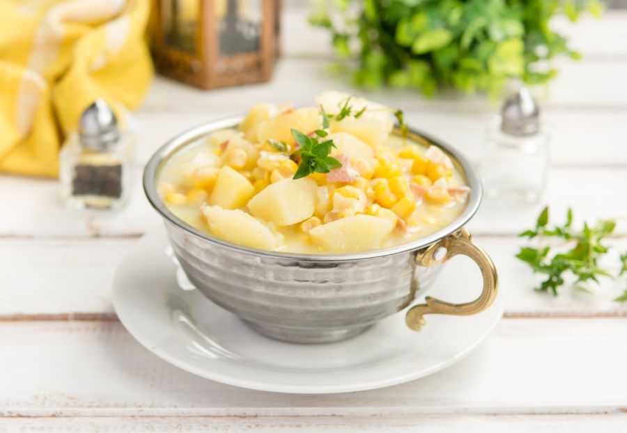 Potato corn chowder with bacon and mint on top