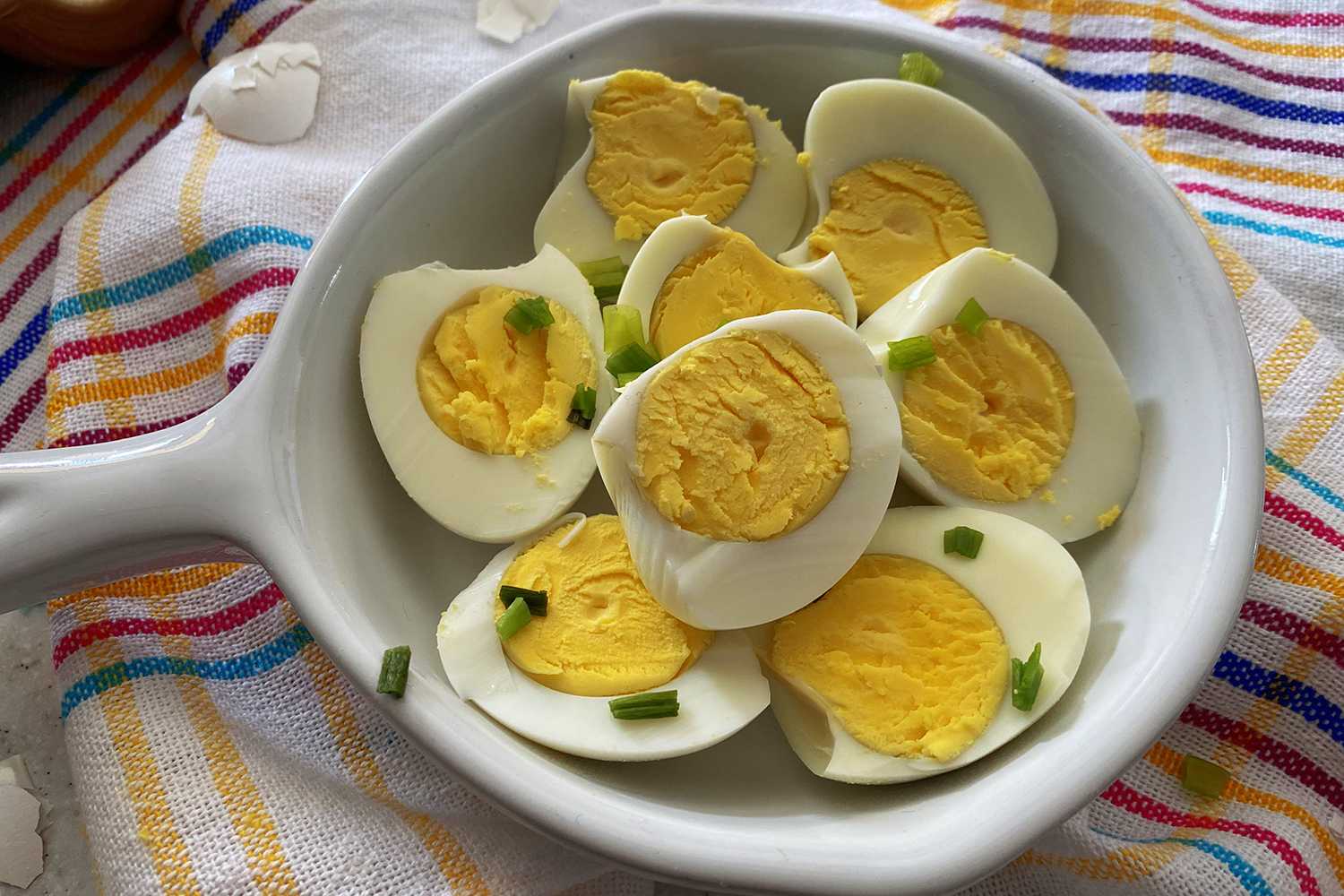 Hard Boiled Eggs cut into half topped with chopped green onion