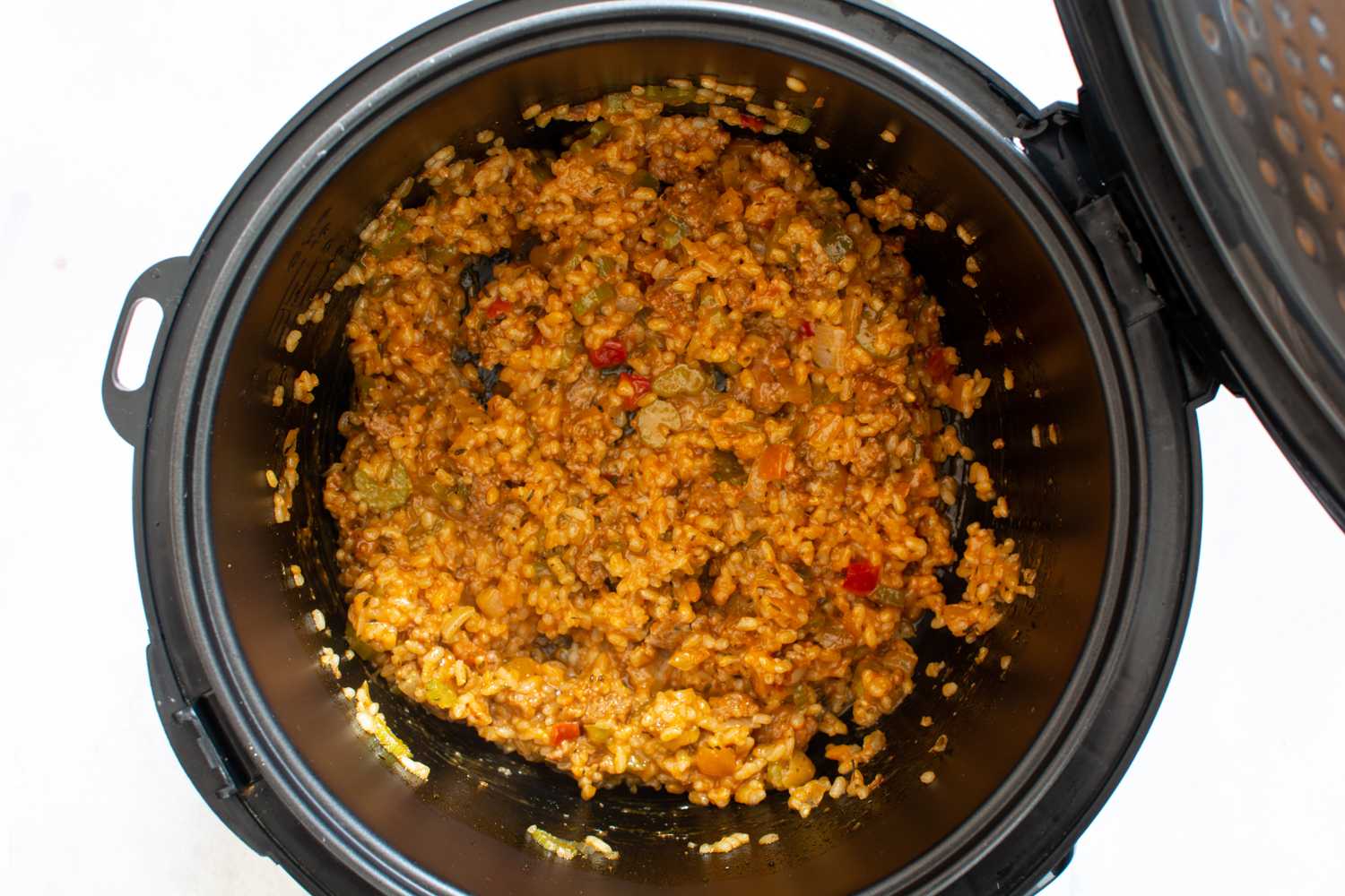 use long-grain white rice, ground beef, and cajun seasoning for a dirty rice Instant Pot cajun dish