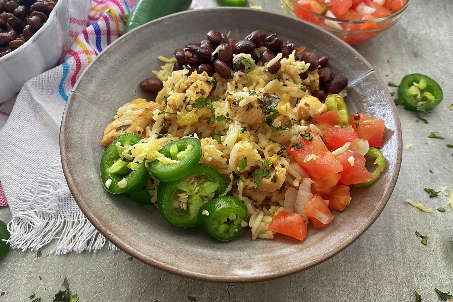 Instant Pot Chicken Burrito Bowl in a white bowl with fresh toppings