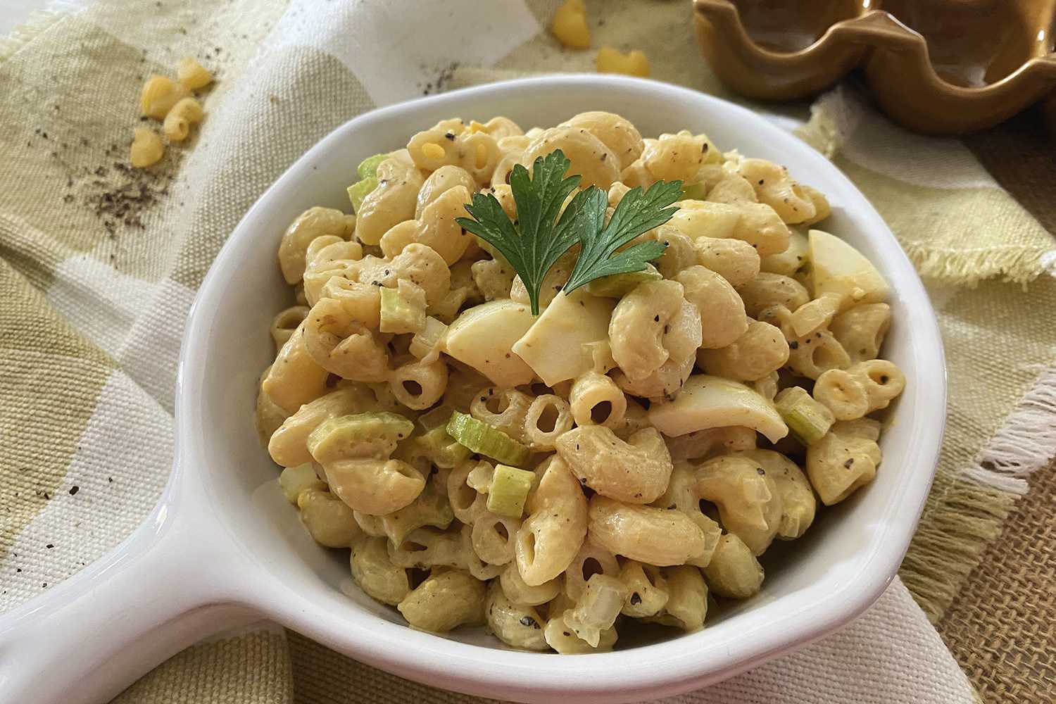 Macaroni with chopped egg and celery topped with parsley