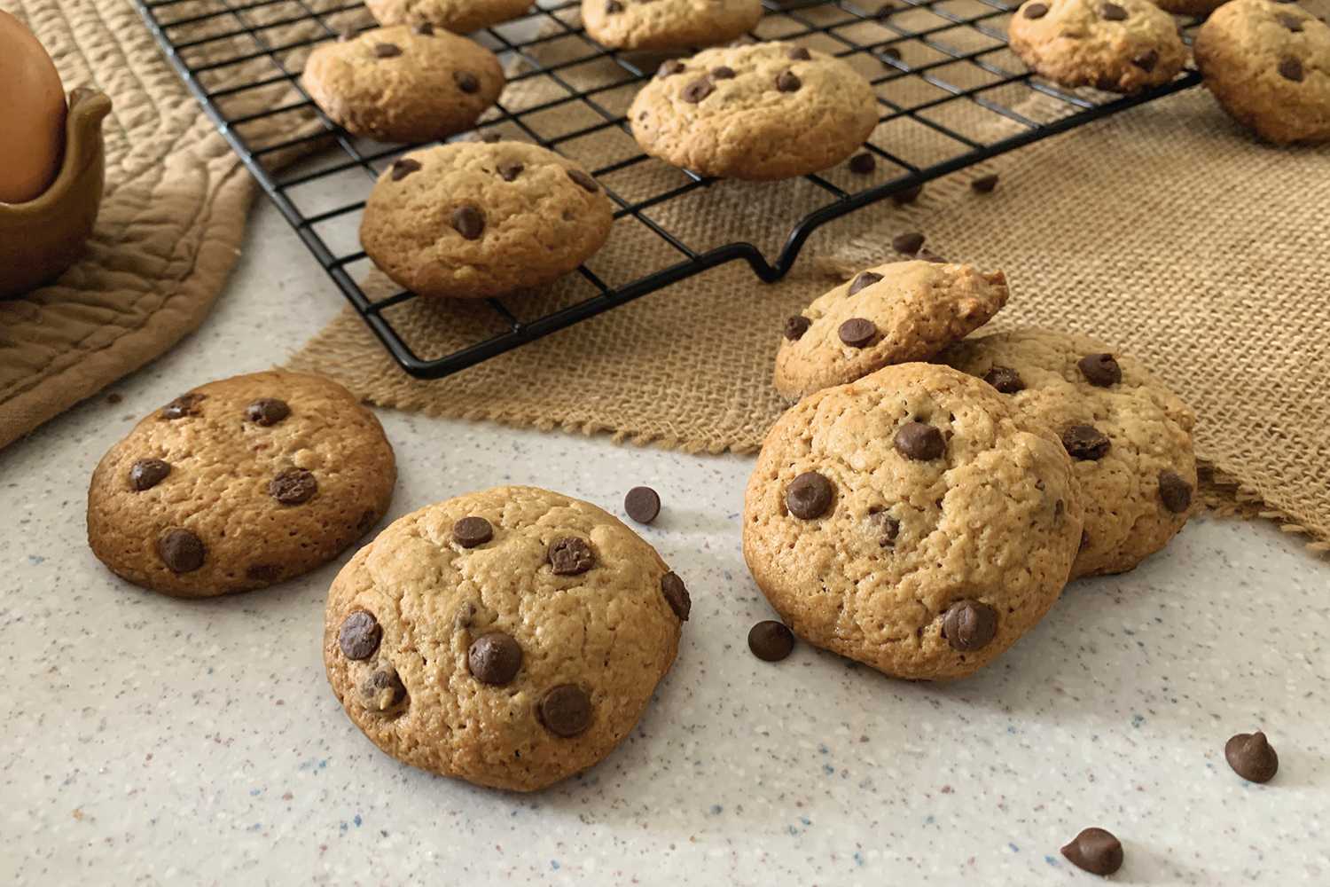 Chocolate Chip Cookies on a white table with Instant Pot Chocolate Chips on side