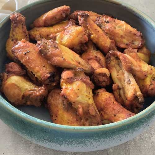 chicken wings in a blue bowl