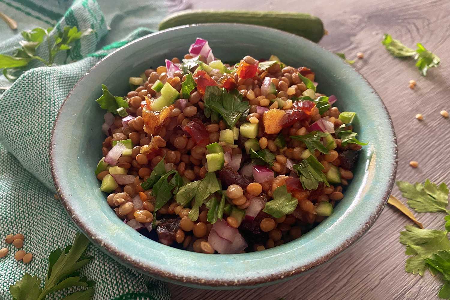colorful salad with lentils, red onion, cucumber and scallion