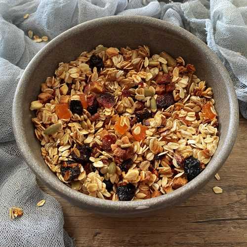 granola mix with rolled oats, nuts, raisins, dried apples and cinnamon.