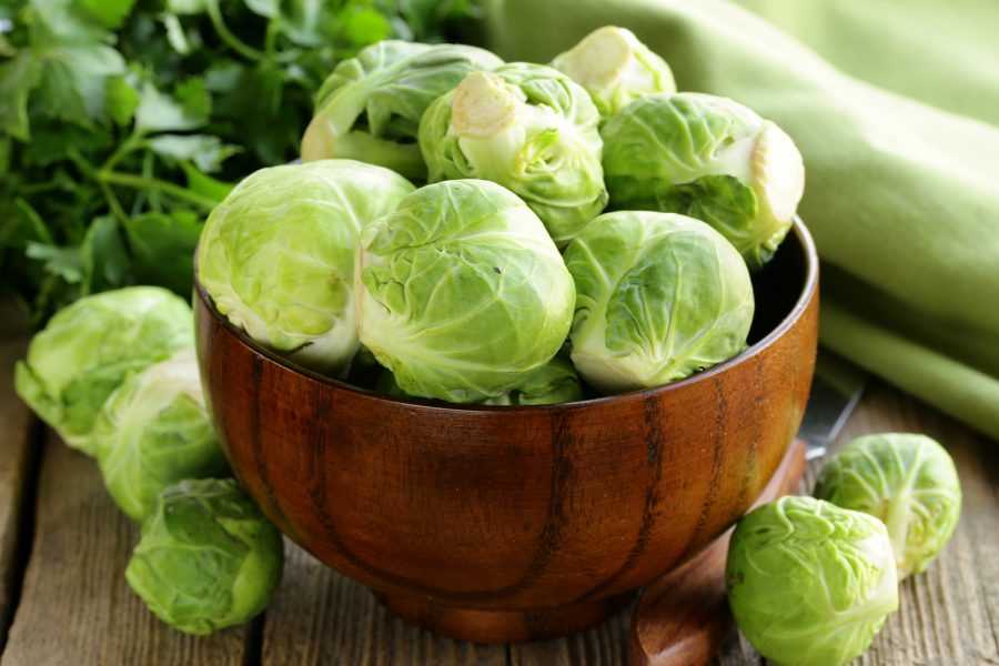 Fresh Brussels Sprouts in brown bowl
