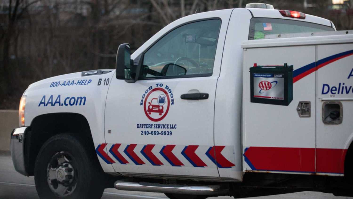 Silver Spring, Maryland / USA - March 17, 2019: A AAA roadside assistance truck drives down I-495 to help a vehicle in need.