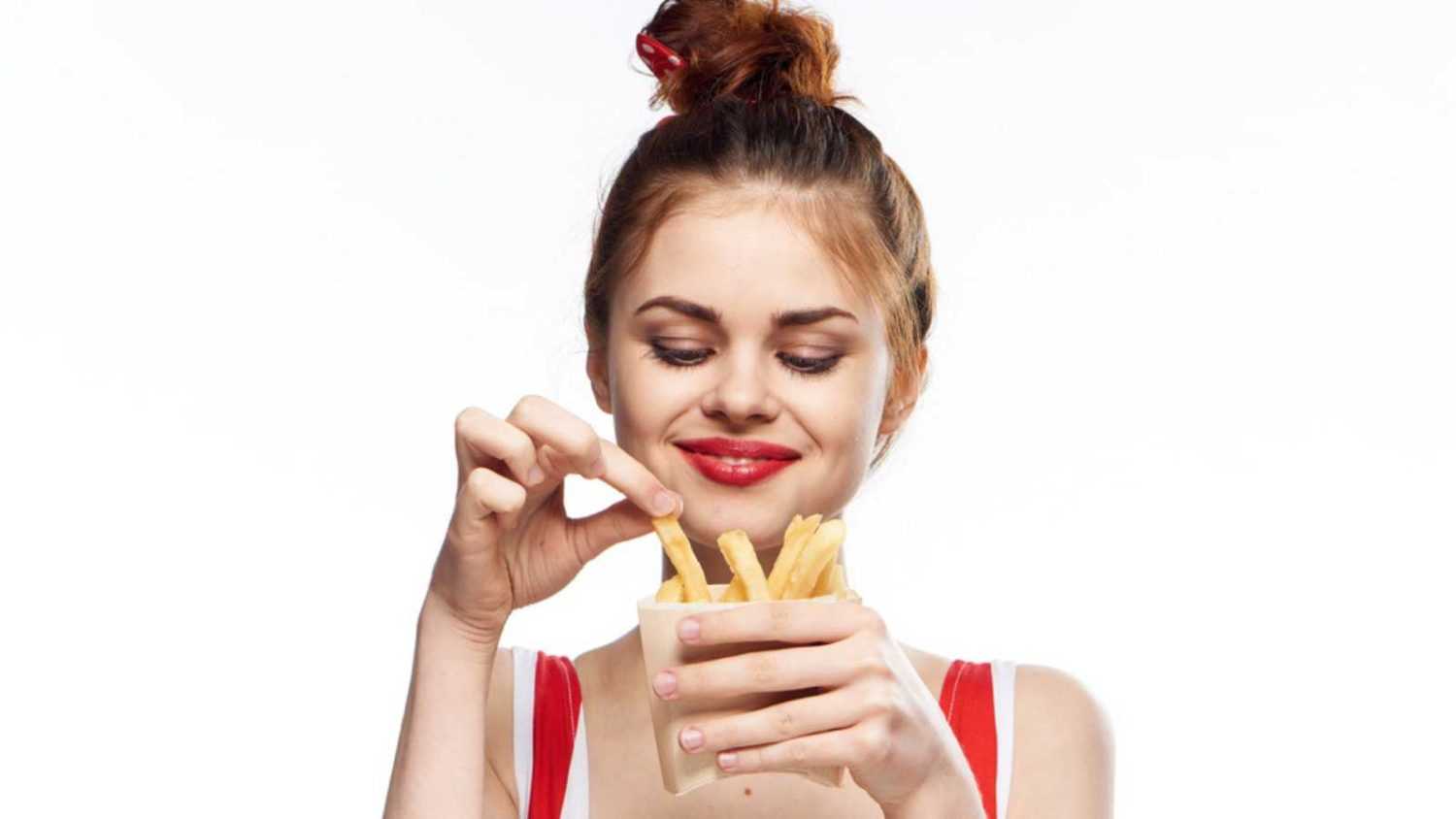 Happy woman with french fries