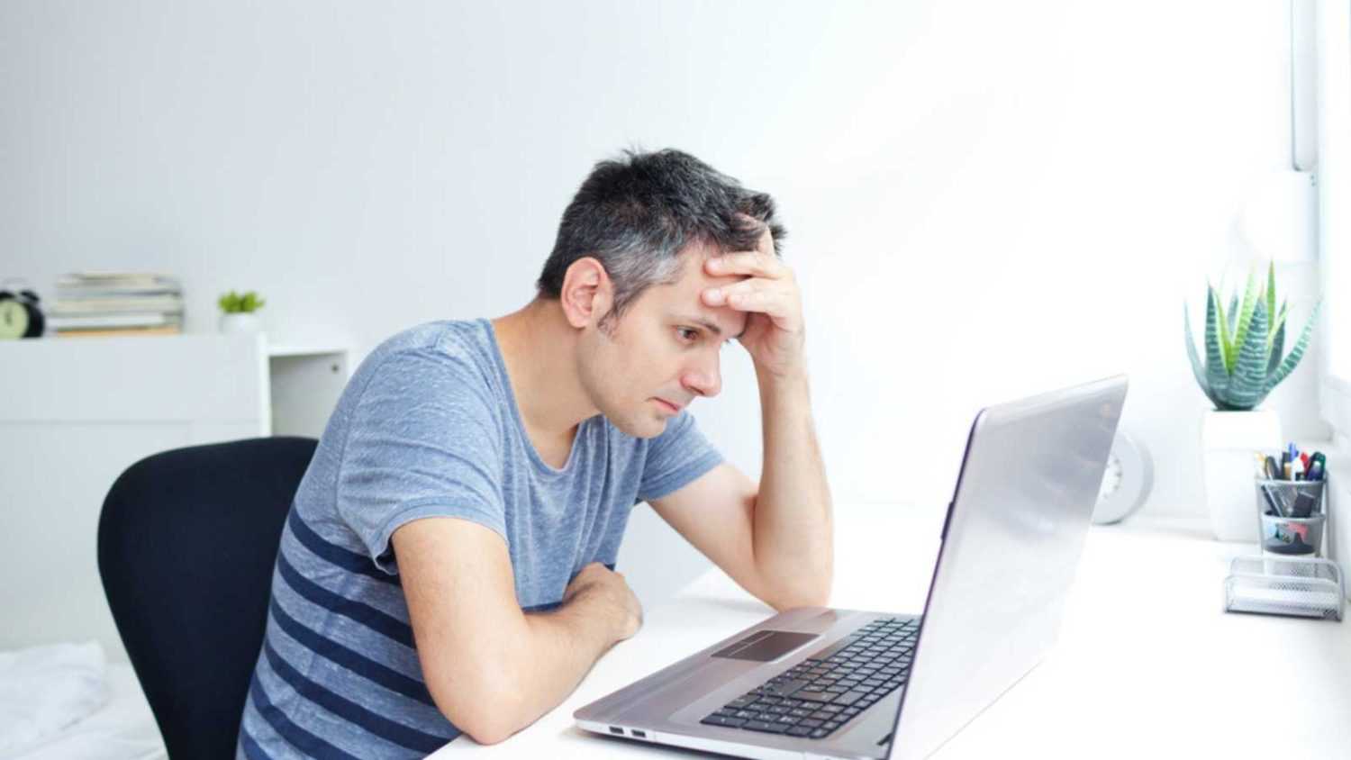 Man stressed with computer