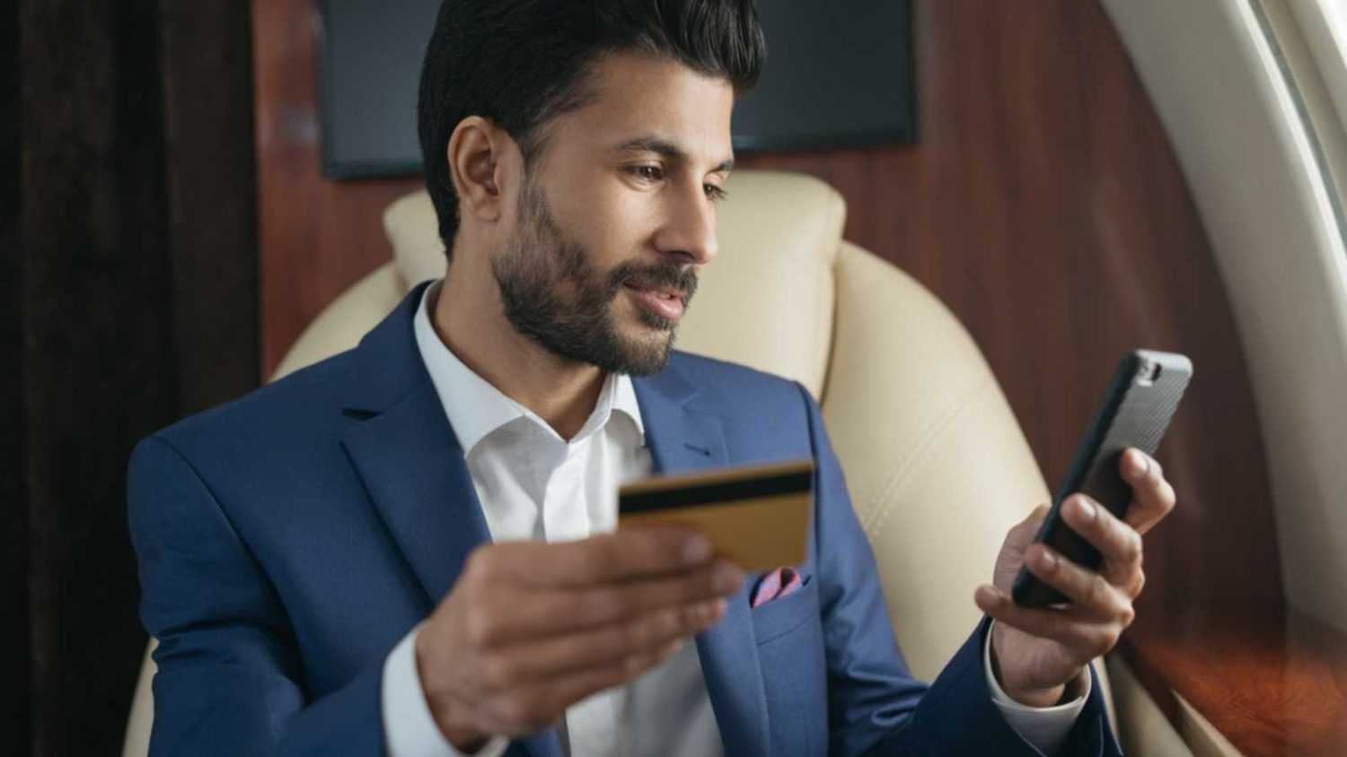 Man with mobile and credit card
