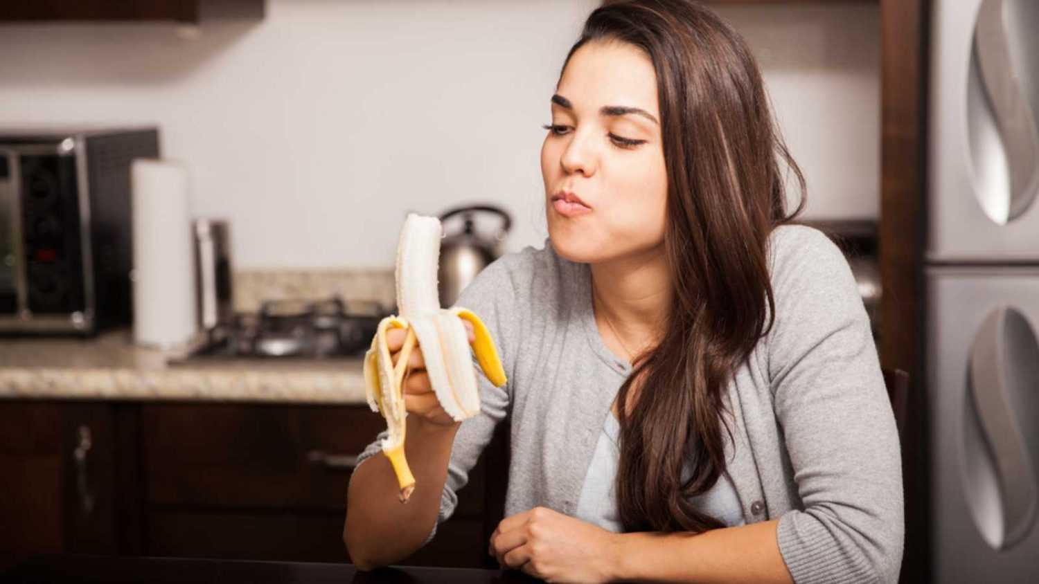 Woman eating Banana