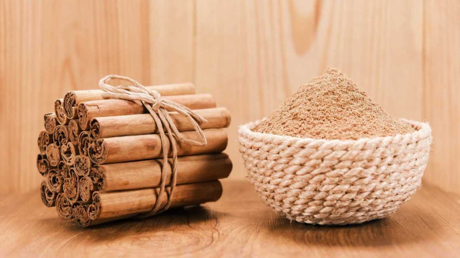 cinnamon stick with powder, wood background, sri lankan ceylon cinnamon