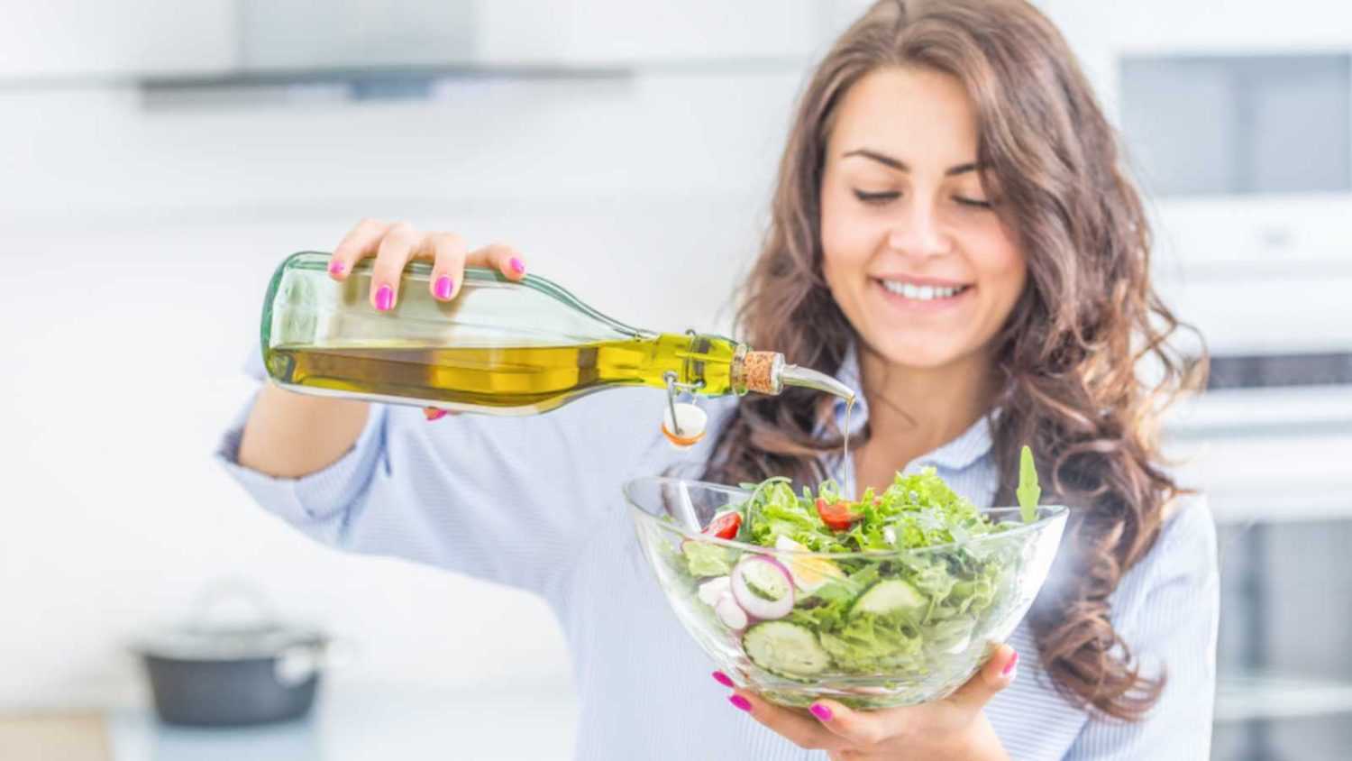 Woman having salad dressing