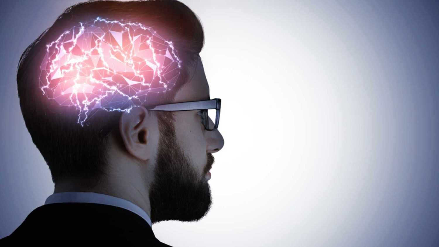 Business man in glasses with glowing digital brain