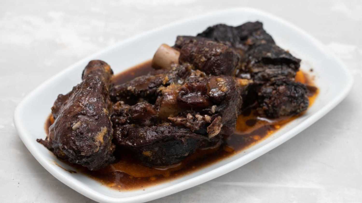 Old goat meat dish Chanfana, traditional portuguese, roasted in pans.