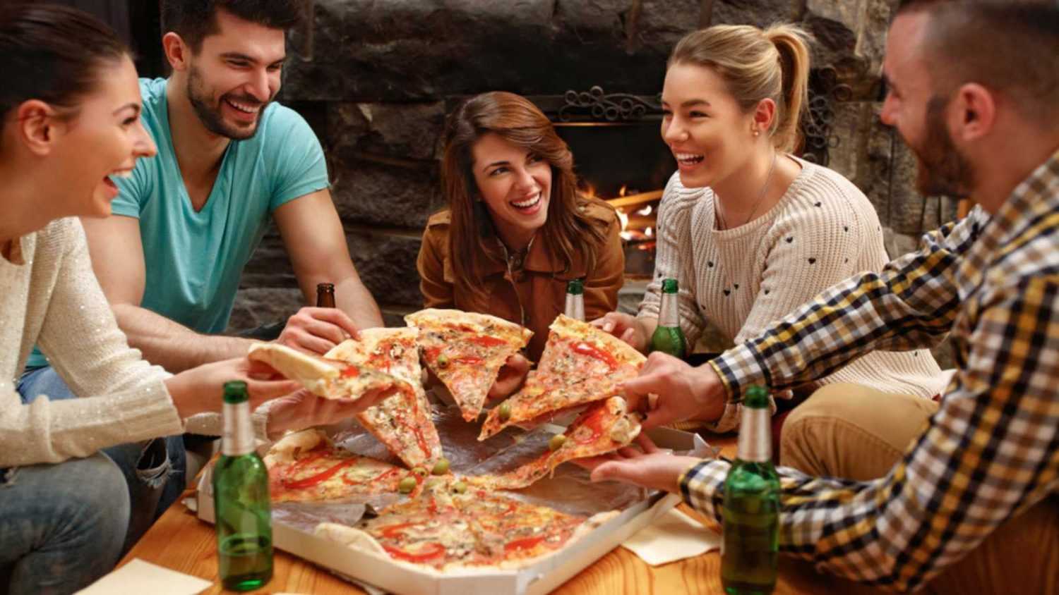 Group of friends eating big Pizza