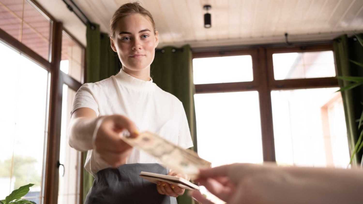 Waitress getting tipped