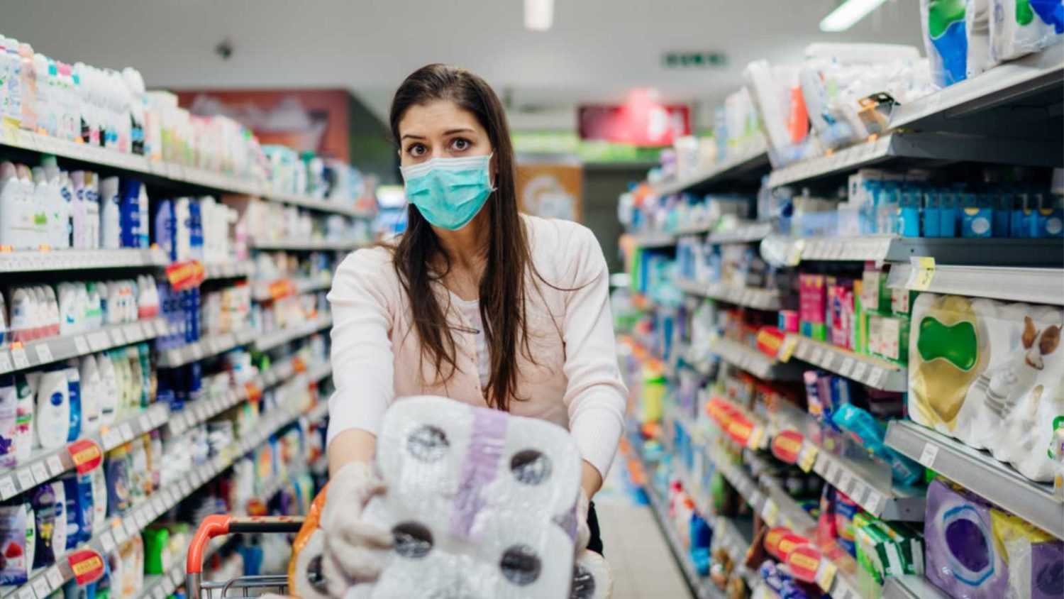 Woman buying toilet papers in bulk