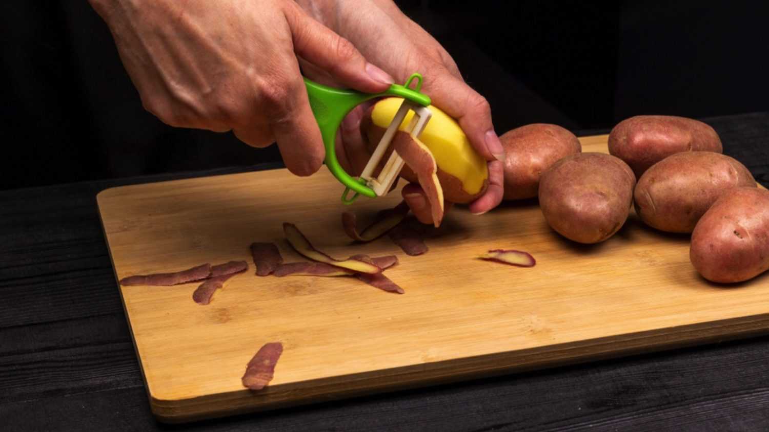 Chef peeling potatoes