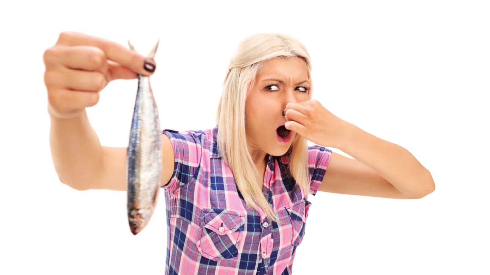 Woman showing rotten fish