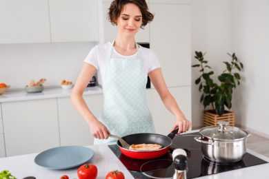 Attractive housewife cooking