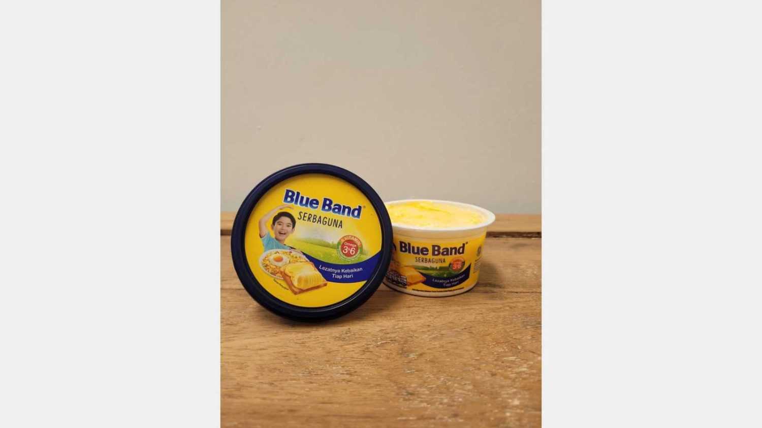 Blue Band margarine is made from vegetable oils and is used as a substitute for butter. It comes in various forms, including block margarine and spreadable margarine