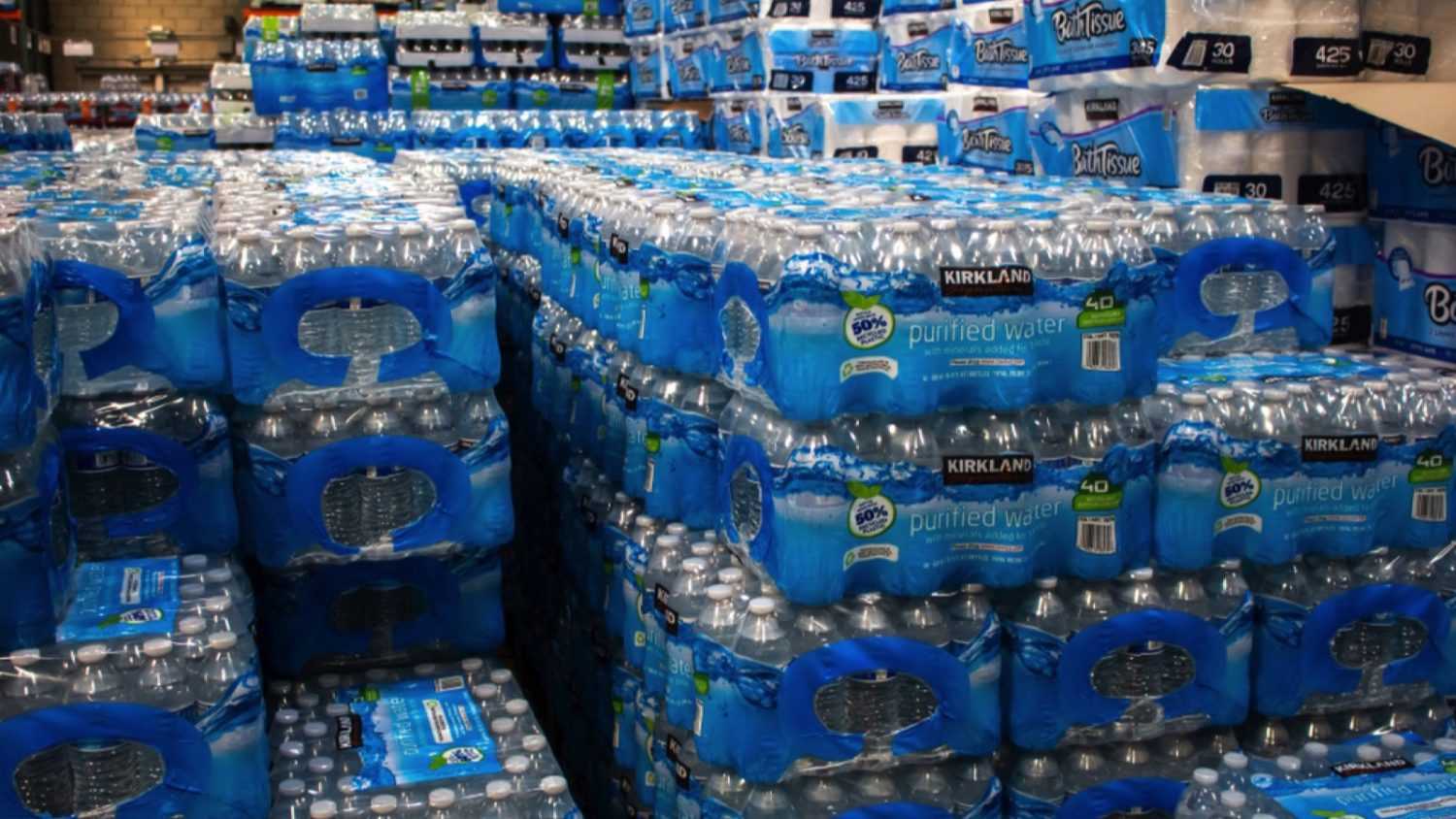 Los Angeles, California, United States - 03-18-2019: A view of several stacks of Kirkland Signature water bottle cases, on display at a local Costco.