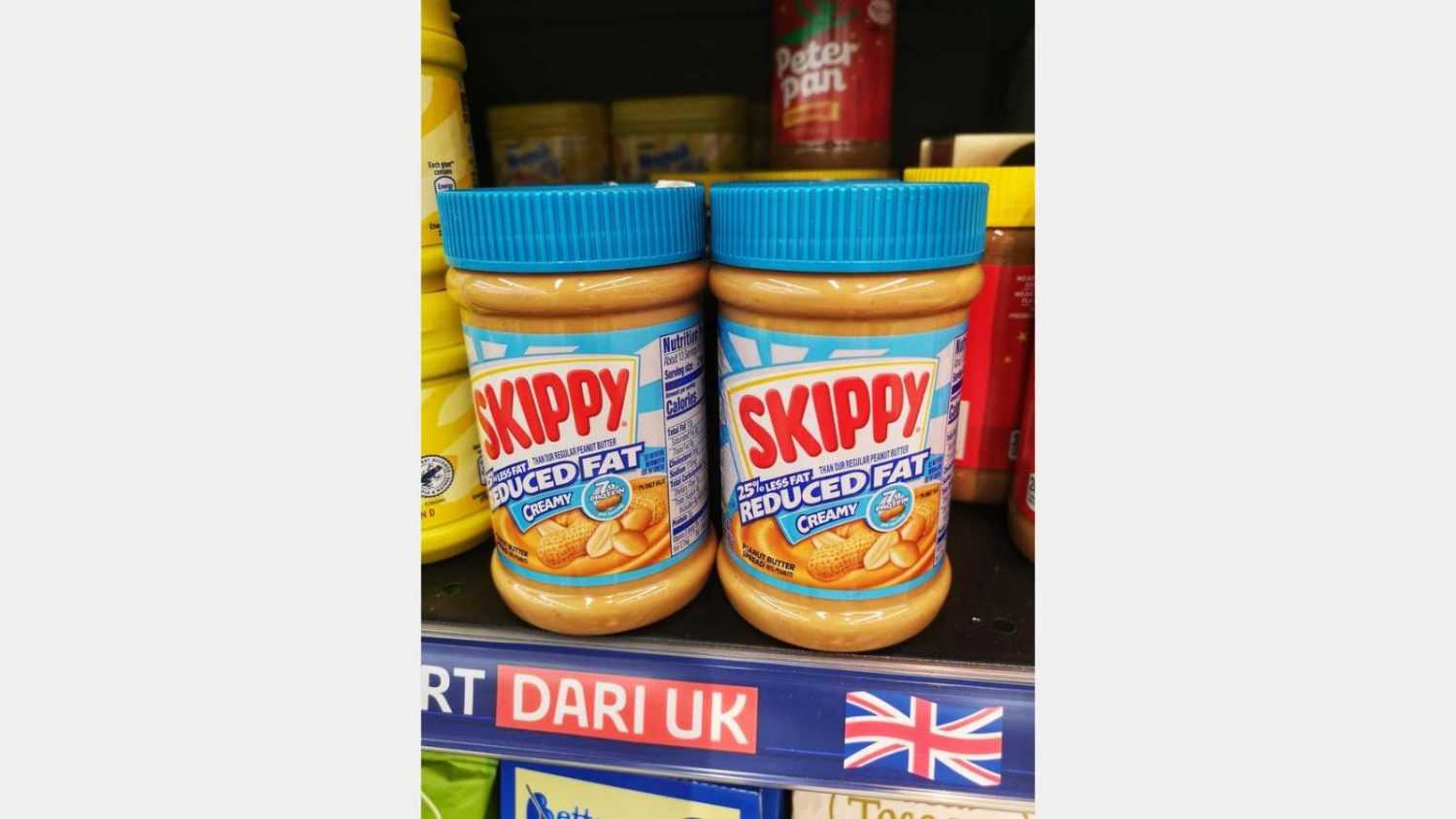 Setia Alam, Malaysia - 16 April 2022 : SKIPPY Peanut Butter Spread jars display for sell on the supermarket shelf with selective focus.