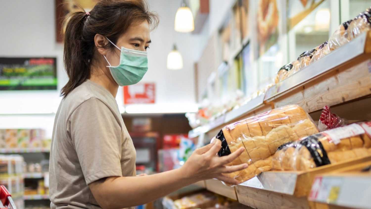 Woman buying bread