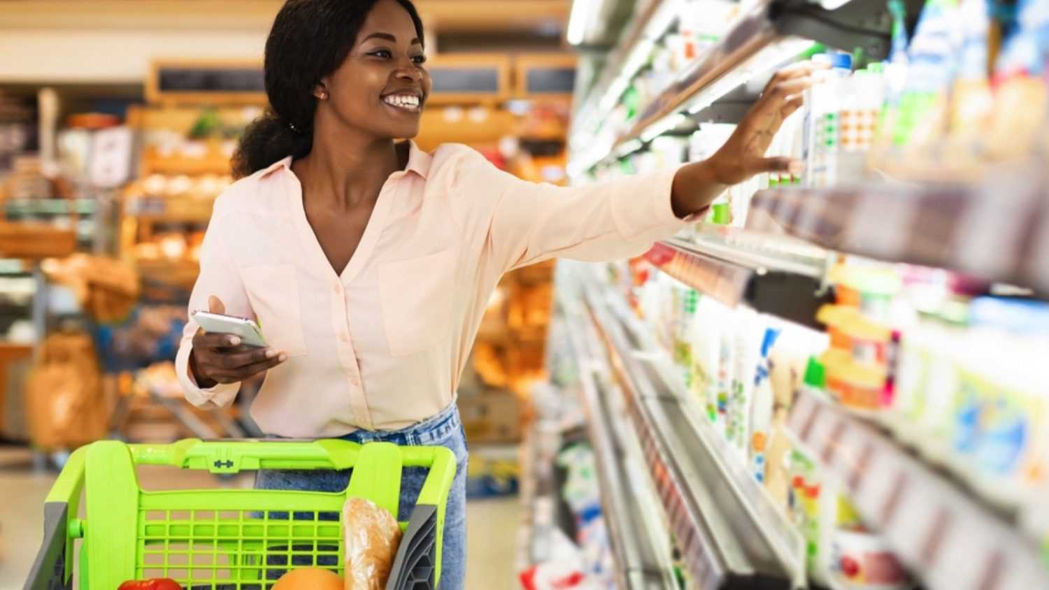 Woman buying in grocery store