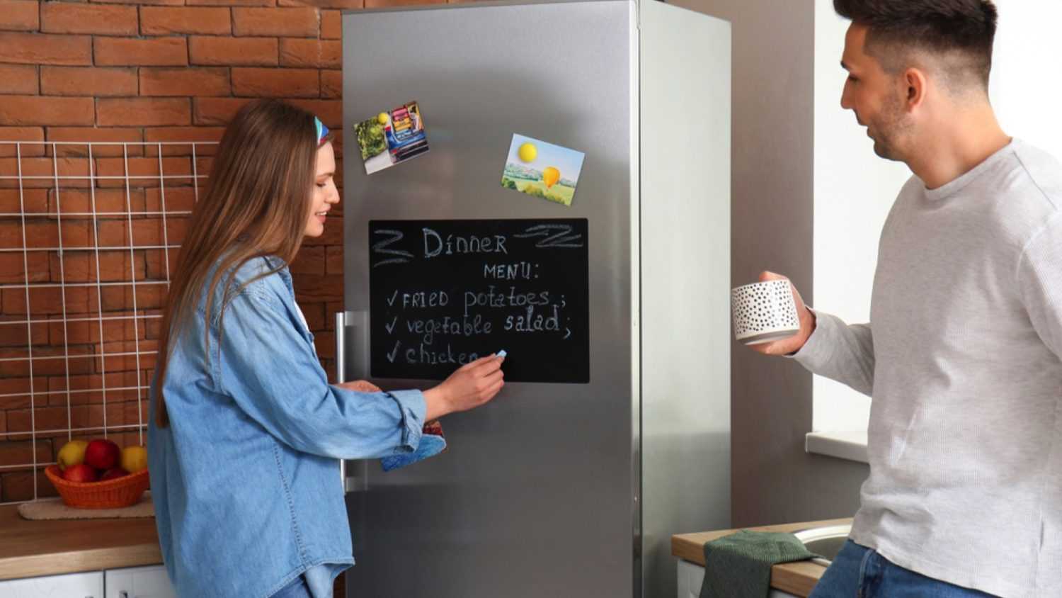 Woman writing in Chalkboard refrigerator