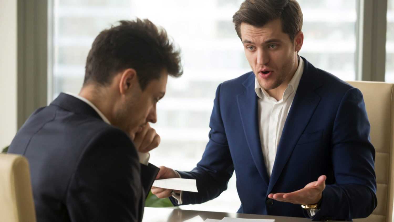 Angry boss yelling at employer