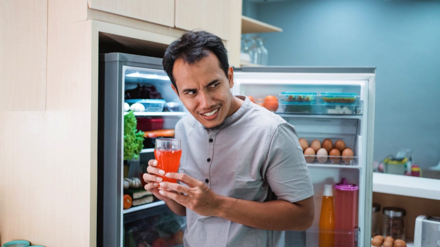 Man taking food from fridge