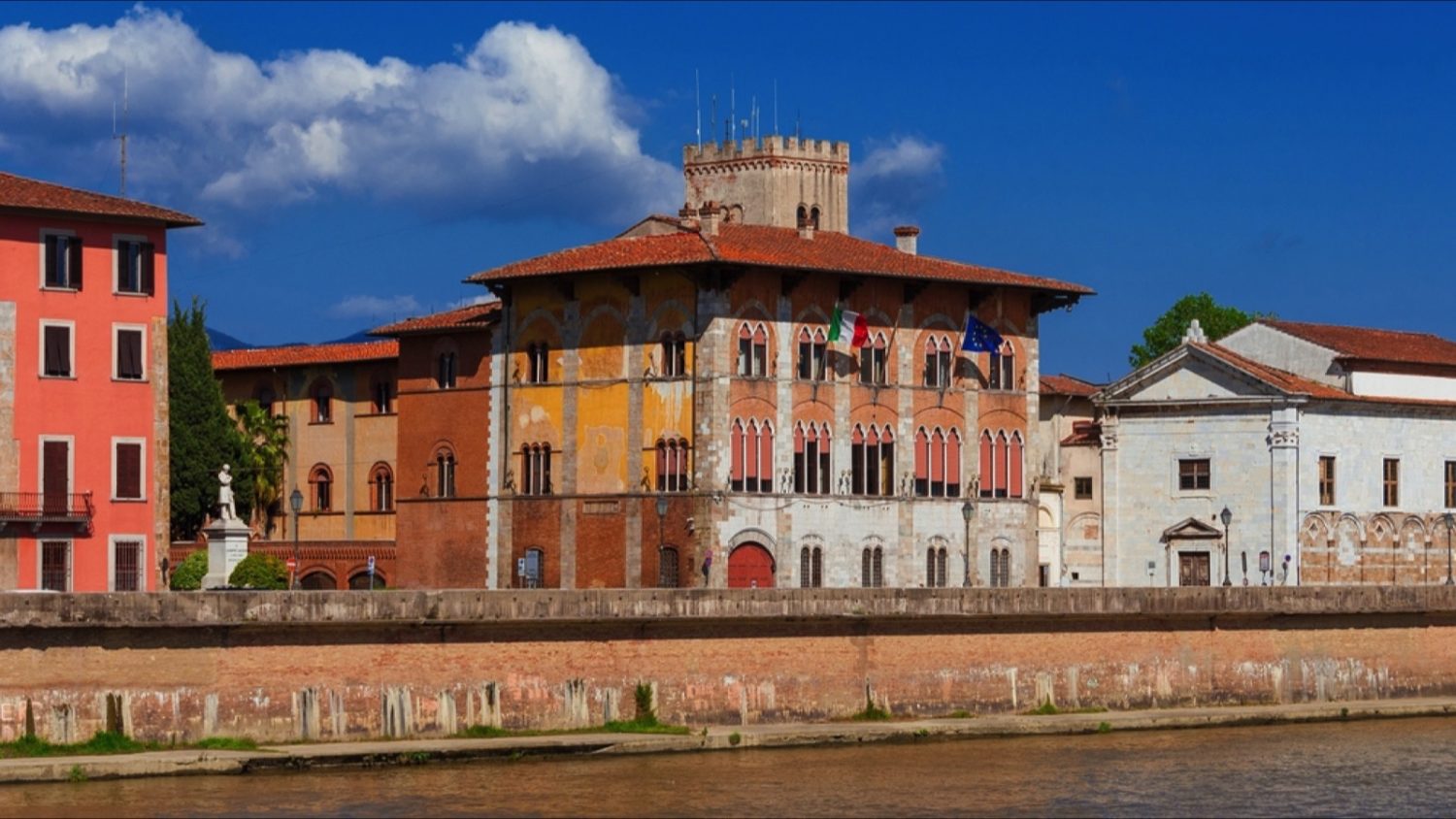 PISA, ITALY - APRIL 27, 2022: Palazzo Medici and National Museum of San Matteo along River Arno waterfront in Pisa