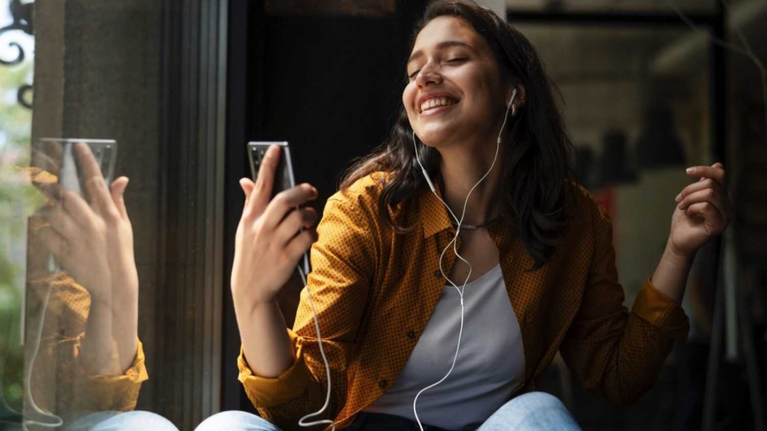 Young woman listening to motivational songs