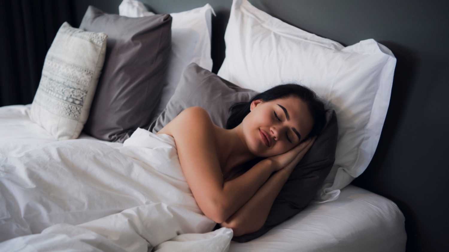 Woman sleeping in mattress
