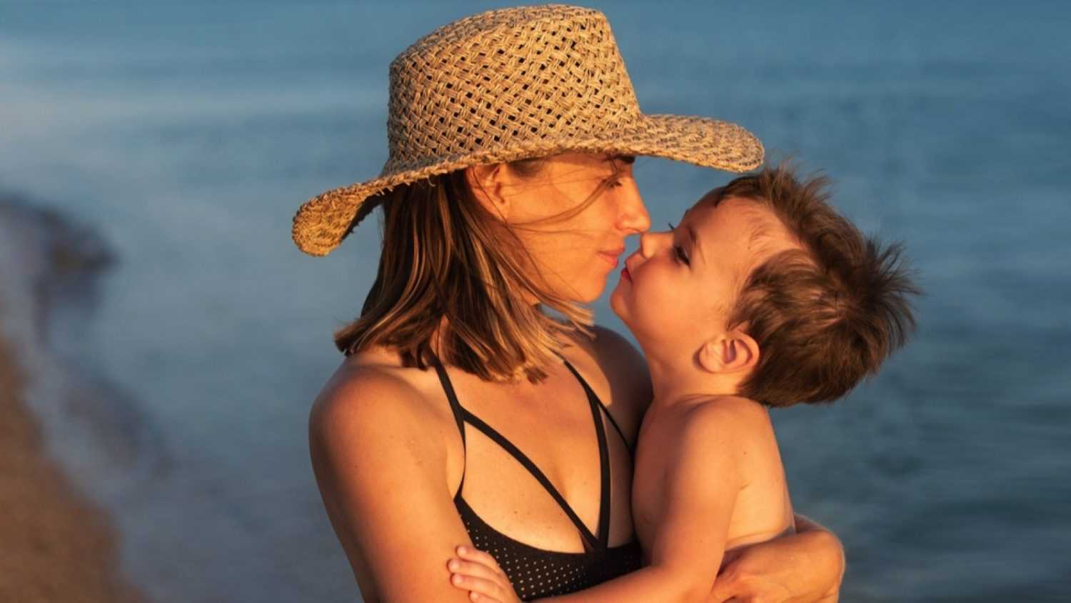 Woman with child wearing Bathing Suit