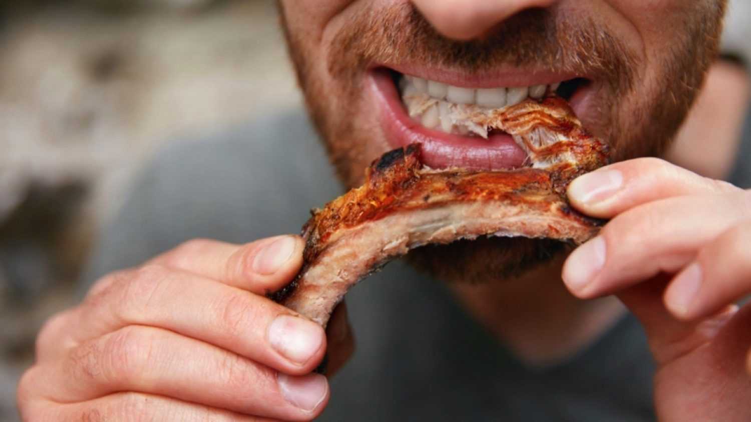 Man eating Barbecue Ribs 