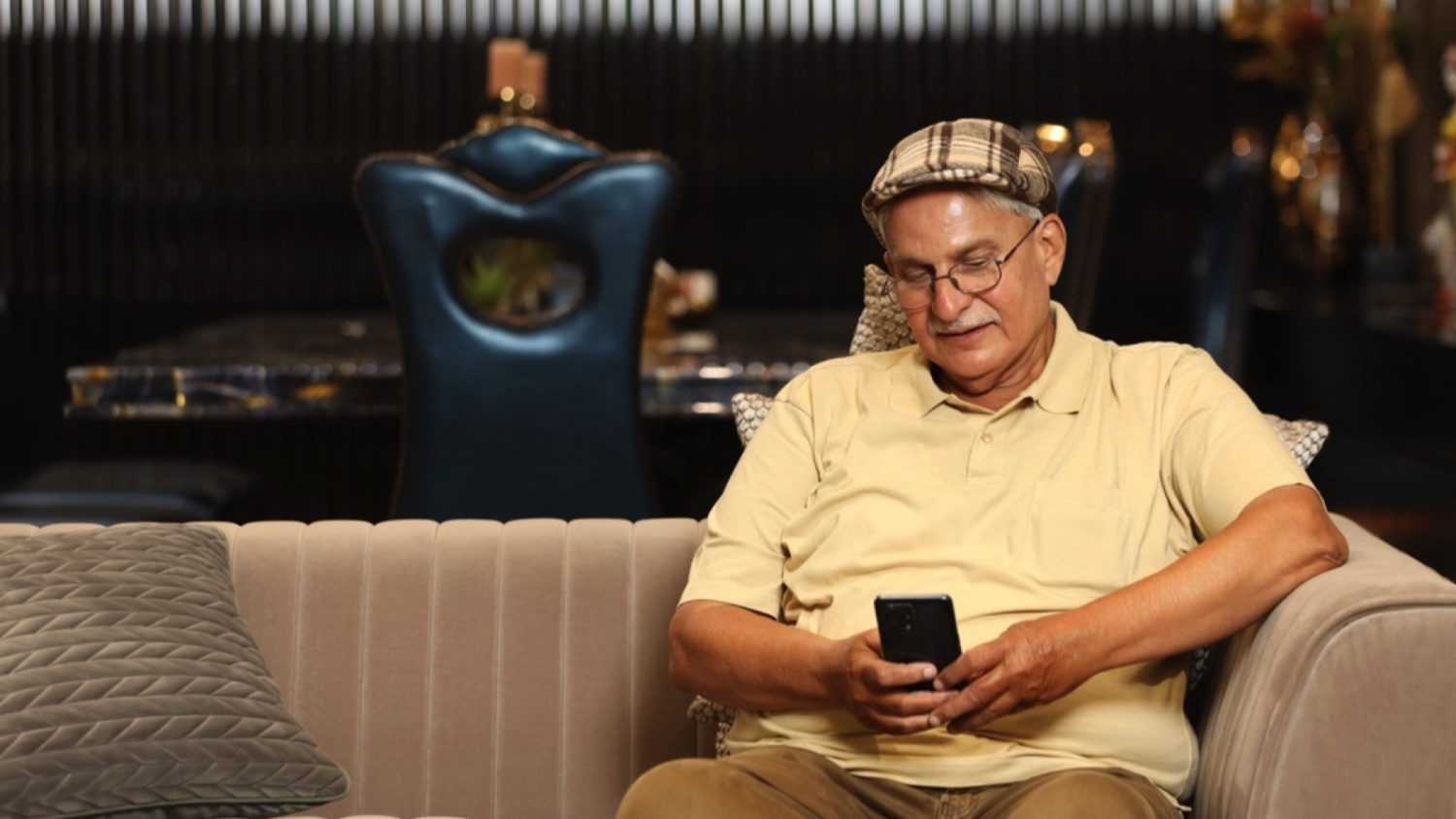 Old senior man using mobile